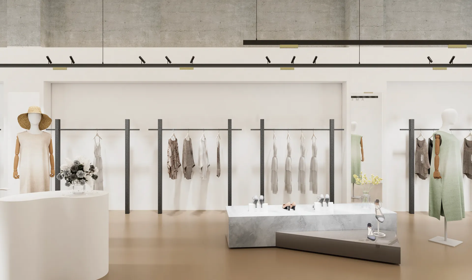 Minimal retail space lit evenly from black track fixtures over concrete