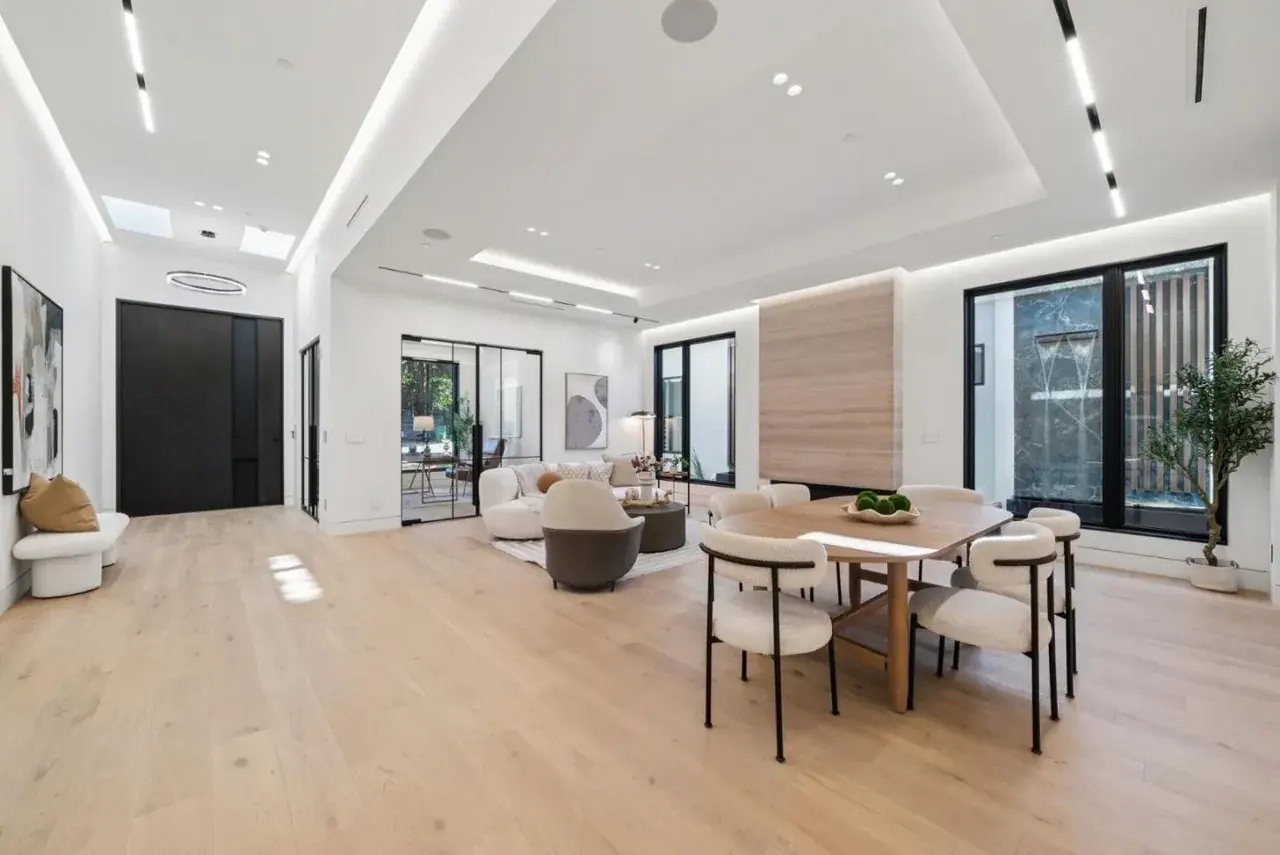 Living and dining space with linear runs following the ceiling