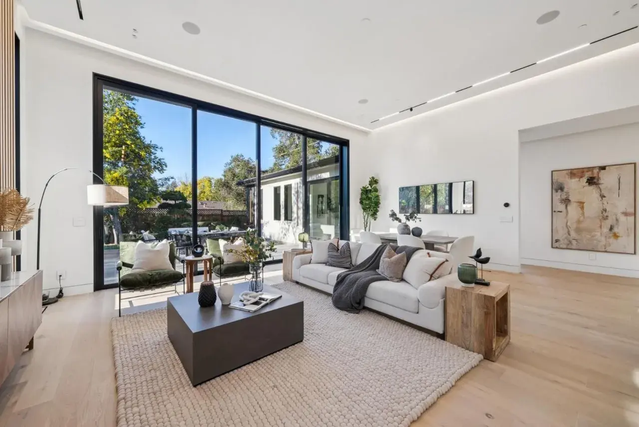 Living room with a sectional and a linear fireplace