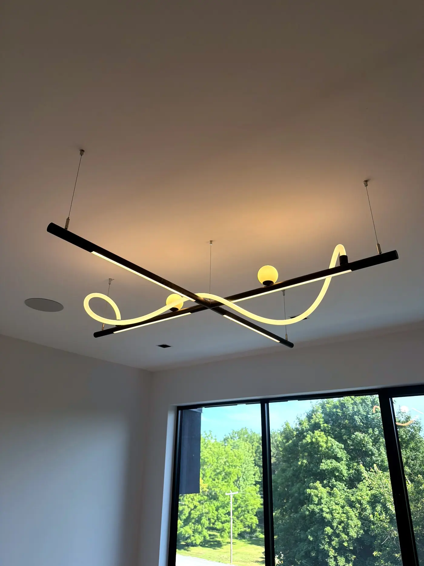 Detail of the linear pendant and its looping light element