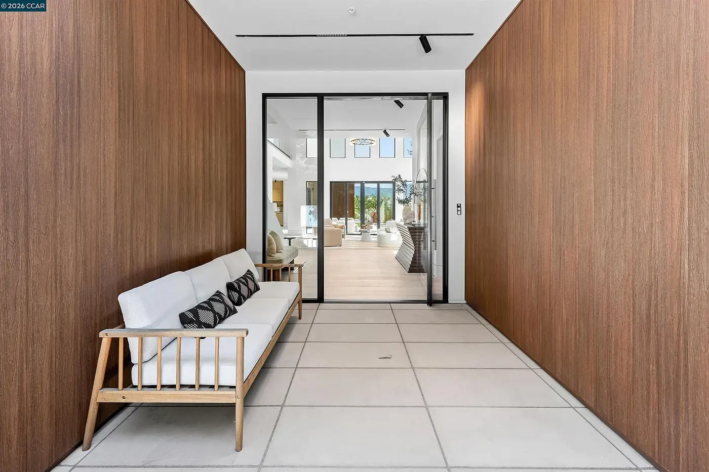 Wood lined corridor opening to the courtyard