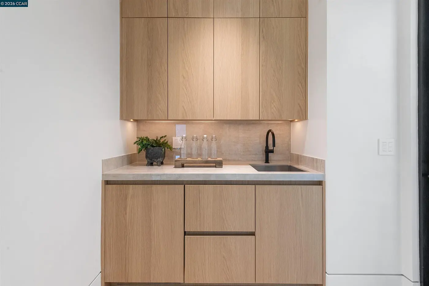 Wet bar with a lit counter recess