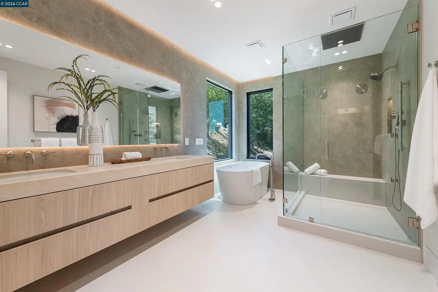 Bathroom with a long vanity and a freestanding tub